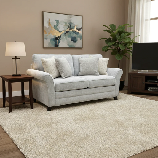 Lifestyle studio shot of the ‘Pippa’ Silver sofa, highlighting its sophisticated floral pattern and contemporary design.