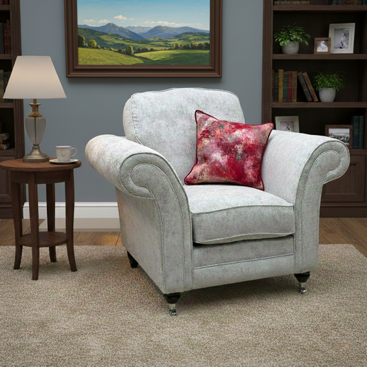 Lifestyle shot of the 'Melody' fabric armchair in a bright room, highlighting its soft texture and comfortable armrests, perfect for a reading nook.