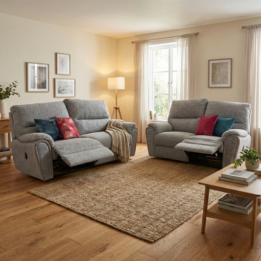 Lifestyle shot of the 'Willow' reclining sofa set in a bright living room, highlighting the comfortable grey fabric upholstery and family-friendly design.