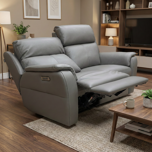 Living room of the 'Vito' sofa showing the refined dark grey leather finish.