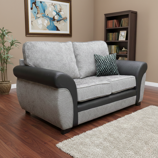 Living Room shot of the Marino’ 2 seater sofa, highlighting the sophisticated blend of textured fabrics and compact silhouette.