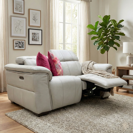 Living room view of the ‘Inca’ 2-seater sofa highlighting the premium leather finish and power headrests.