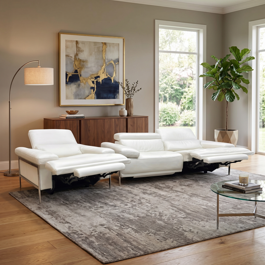 Living room view for the Nicoletti Theron suite, highlighting the premium Italian leather, power reclining motors, and ergonomic support.