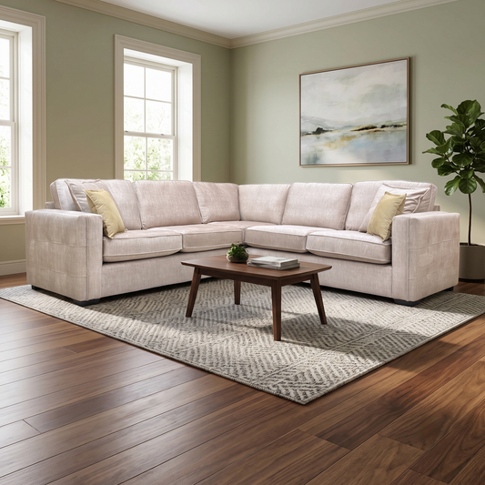 Lifestyle shot of the Chelsea beige velvet sofa in a bright living room, emphasizing its sophisticated design and plush seating.