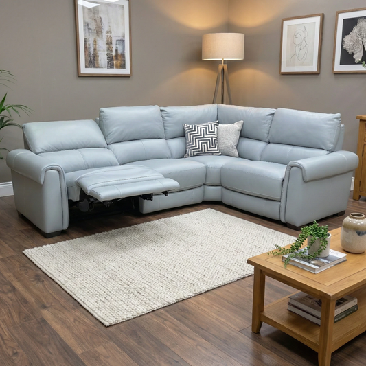 Living room of the Nixon power recliner sofa, highlighting its Pearl Blue 100% leather upholstery and ergonomic comfort features.