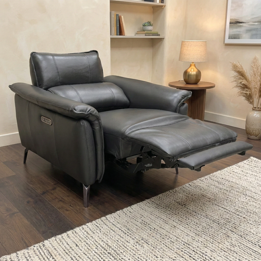 Living Room view of the jet black leather recliner chair, highlighting its sleek profile and premium leather finish.