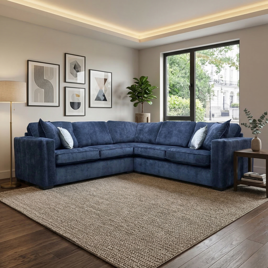 Living room view of the Chelsea 2-corner-2 sofa, showing the generous seating capacity and deep denim blue upholstery.