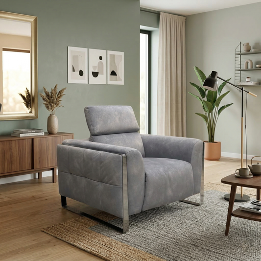Living room view of the Gisella chair, showcasing the wide seat design and the fixed, encapsulated pocket spring cushion.
