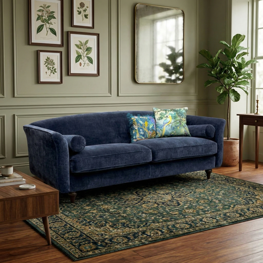 Living room view of the Dame navy blue sofa, showing the wide seating area and sleek, modern fabric finish.