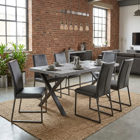 Dining room view for the Moon Large Dining Table, highlighting the textured concrete-effect surface and the sturdy fixed-top construction.