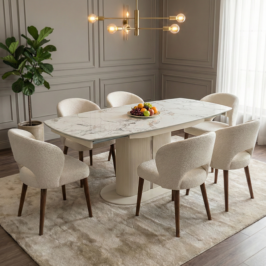 Dining room shot showing the Avorio table styled in a bright, modern dining room with minimalist chairs.