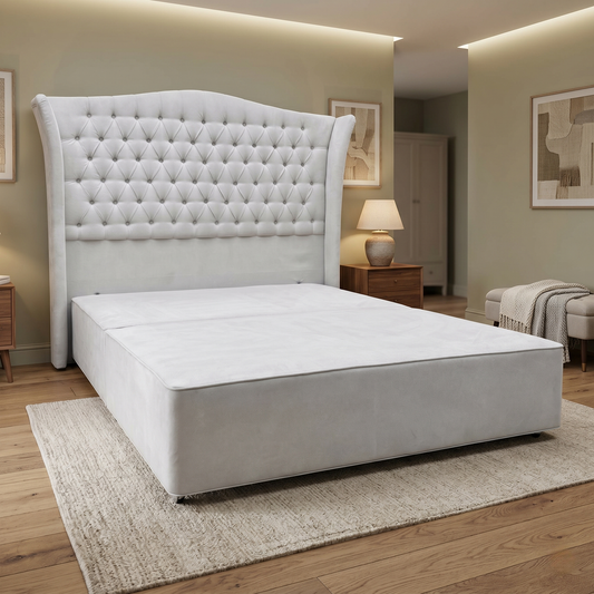 Living room Furniture Village Hypnos ‘Hambleden’ king-size divan bed ensemble, featuring a tall, winged floor-standing headboard and bespoke divan base upholstered in rich Imperio 903 stone grey fabric.