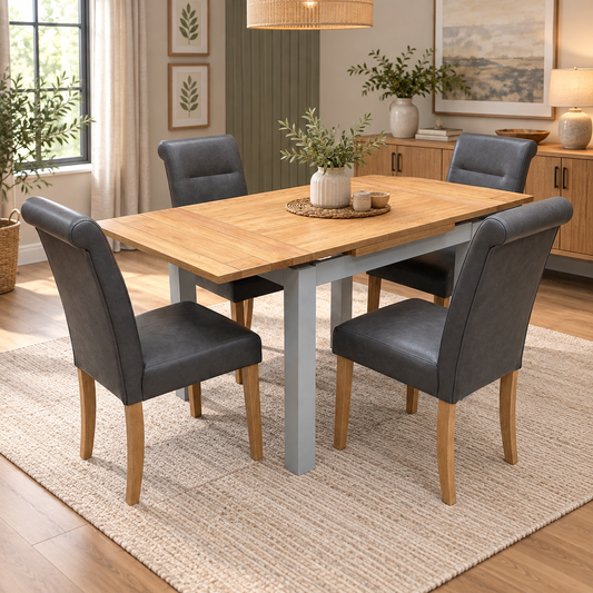 Lewis oak extending dining table, extended, with four dark grey roll back chairs in a dining room with a jute rug