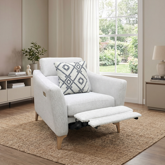 Living room view of the Moderna pearl grey fabric power reclining chair fully extended, showcasing the electric footrest and smooth motorized mechanism for customized lounge comfort.