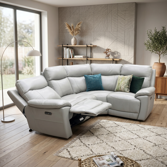 Living room view of power recliner section of the Sloane grey leather corner sofa fully extended, demonstrating the motorized footrest and independent power headrest adjustment.