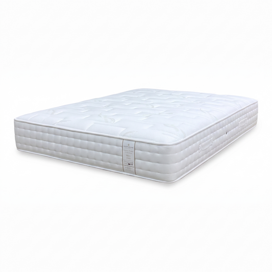 Full View ‘Ilkley’ luxury pocket sprung king-size mattress, showcasing its multi-layered design with a crisp white tufted top cover and beautifully tailored side border panels.