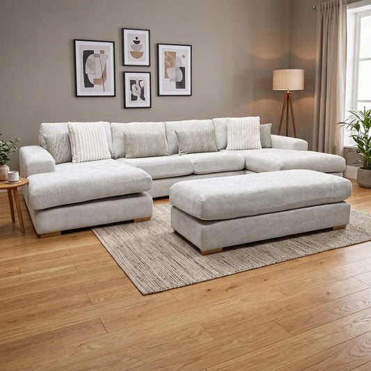 Styled upscale grand living room lifestyle layout featuring the complete Broadgate Stone fabric U-shape modular sofa and footstool arranged as an inviting, luxury home theater and family lounge center.
