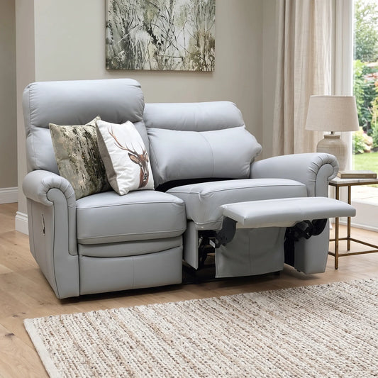 Styled upscale contemporary living room lifestyle layout featuring the G Plan Avon Cambridge Grey leather 2-seater manual recliner sofa arranged as a luxurious, cozy home comfort centerpiece.