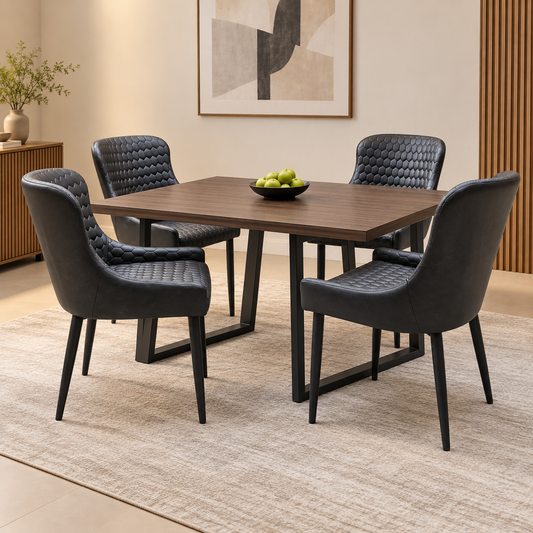 Four Osaka black faux leather dining chairs around a walnut-effect table in a dining room scene