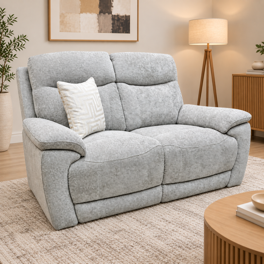 Sloane dove grey woven fabric 2 seater sofa in a living room with a tripod lamp, rug and round wooden table