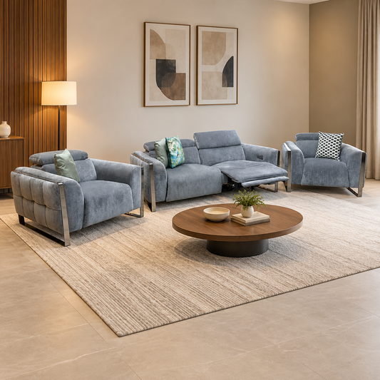 Gisella charcoal grey linen 3 seater recliner sofa and two chairs in a living room with a round wooden coffee table