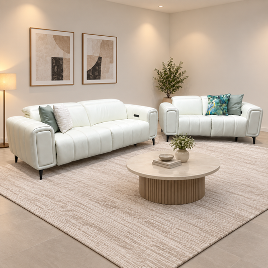 Elphaba cotton white leather 3 + 2 seater recliner sofa set in a neutral living room with a round coffee table