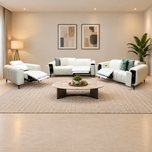 Elphaba white leather 3 + 2 seater sofas and power chair reclined in a living room with a round marble coffee table