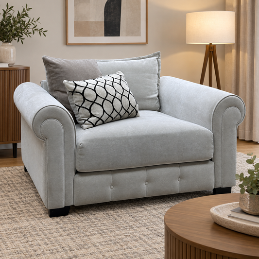 Sumptuous linen fabric snuggler chair in a living room with a tripod floor lamp