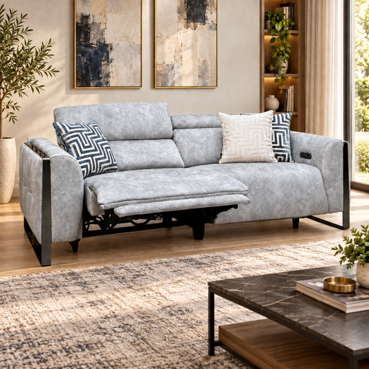 Gisella marble stone grey velvet 3 seater power recliner sofa reclined in a living room with a marble coffee table