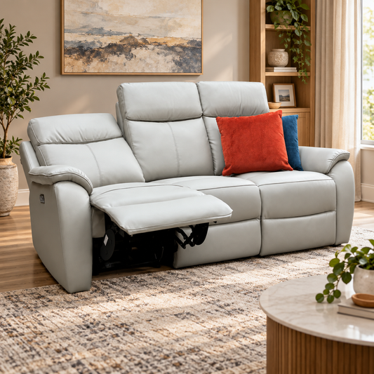 Kingsmere pewter grey leather 3 seater power recliner sofa in a living room with one seat reclined