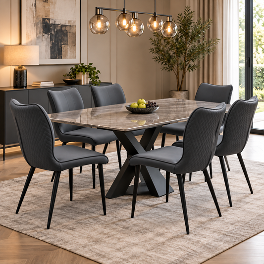 Clio grey faux leather dining chairs, set of six, around a marble-effect table in a dining room with pendant lights