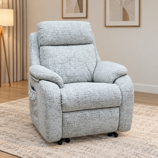 G Plan Kingsbury mist grey fabric lift and rise recliner chair in a living room with a floor lamp and patterned rug
