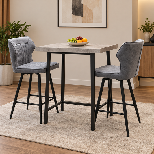 Jayden dark grey faux leather swivel bar stools either side of a square concrete-effect bar table in a dining room