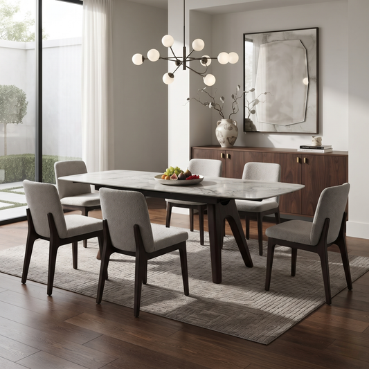 Valley grey marble effect dining table with grey chairs in a dining room under a globe light
