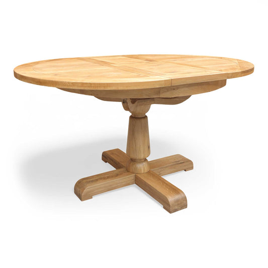 Full view of the Furnitureland Augusta round extending dining table, showcasing its natural wood grain tabletop, rustic finish, and sturdy central pedestal base.