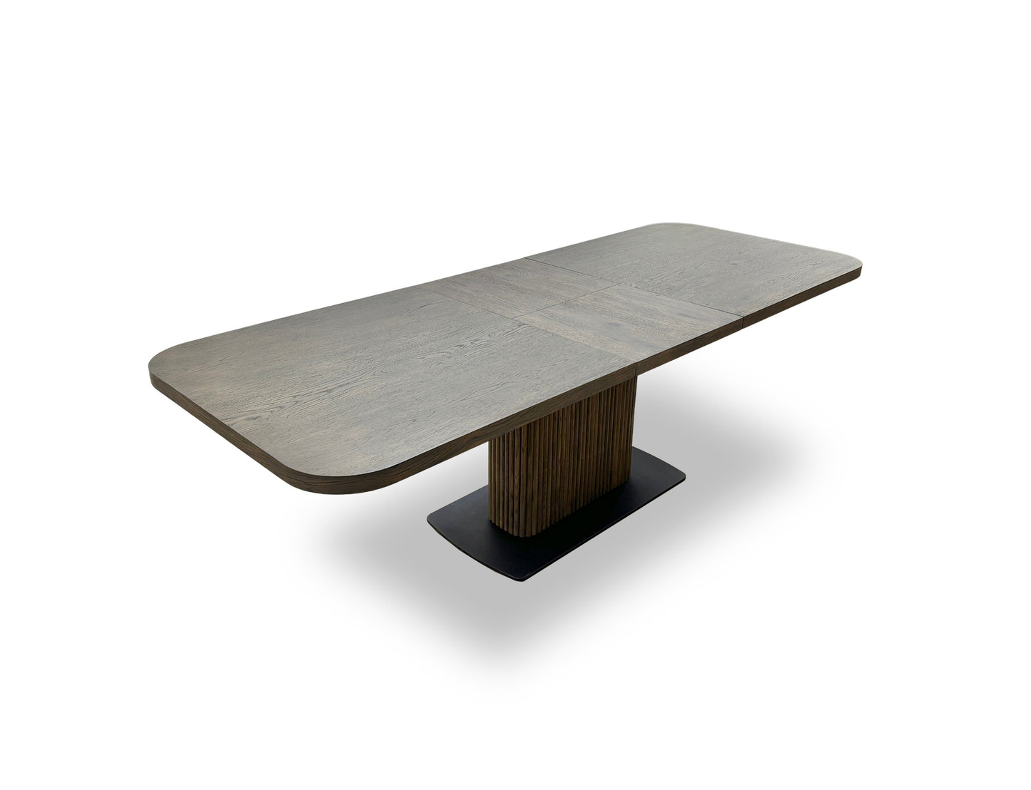 Angled detail shot of the oak pedestal base, showing its texture, grooves, and the supporting black metal plinth.