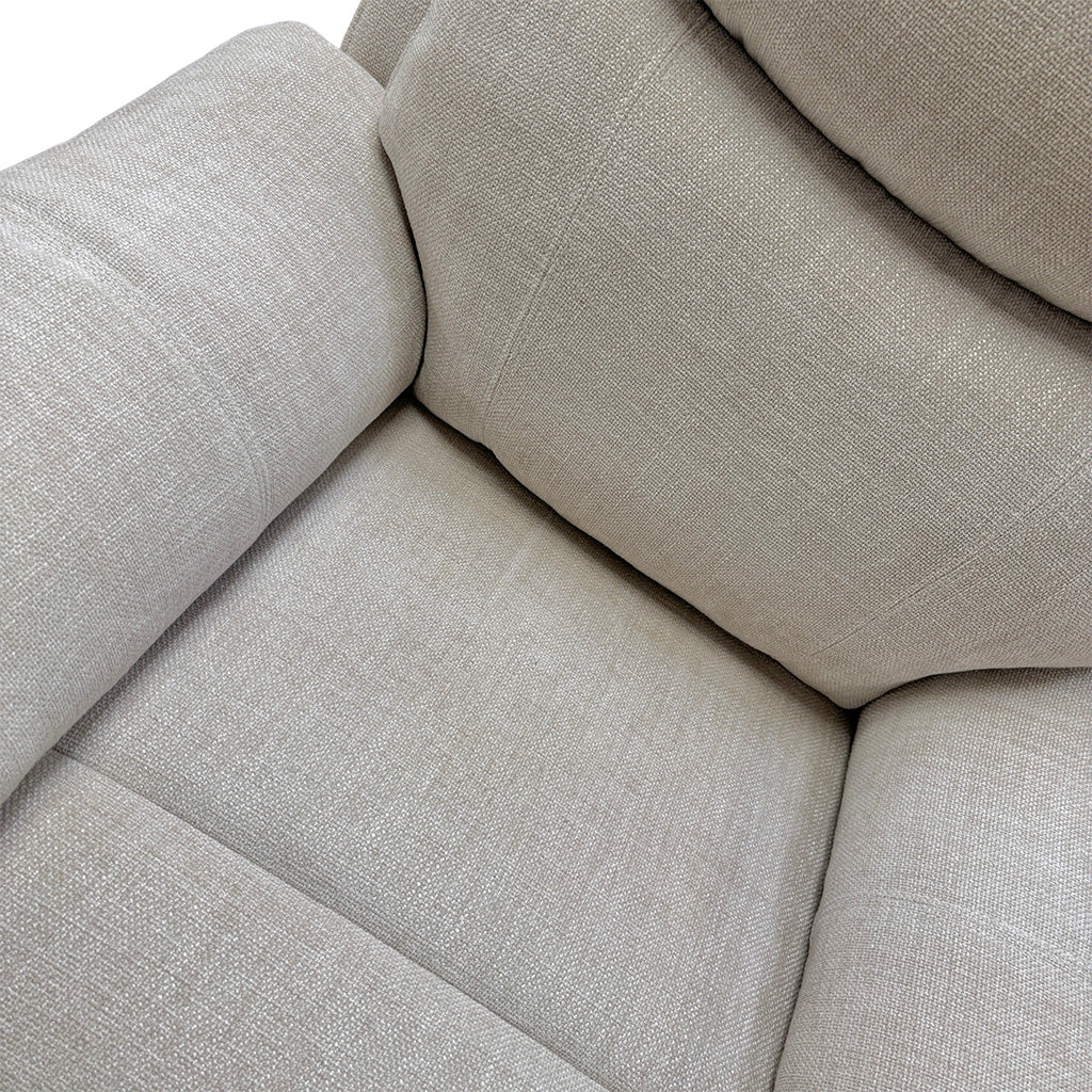 Close-up view showing the comfortable, fixed seat cushion with pocket springs and the generous padding of the armrest.