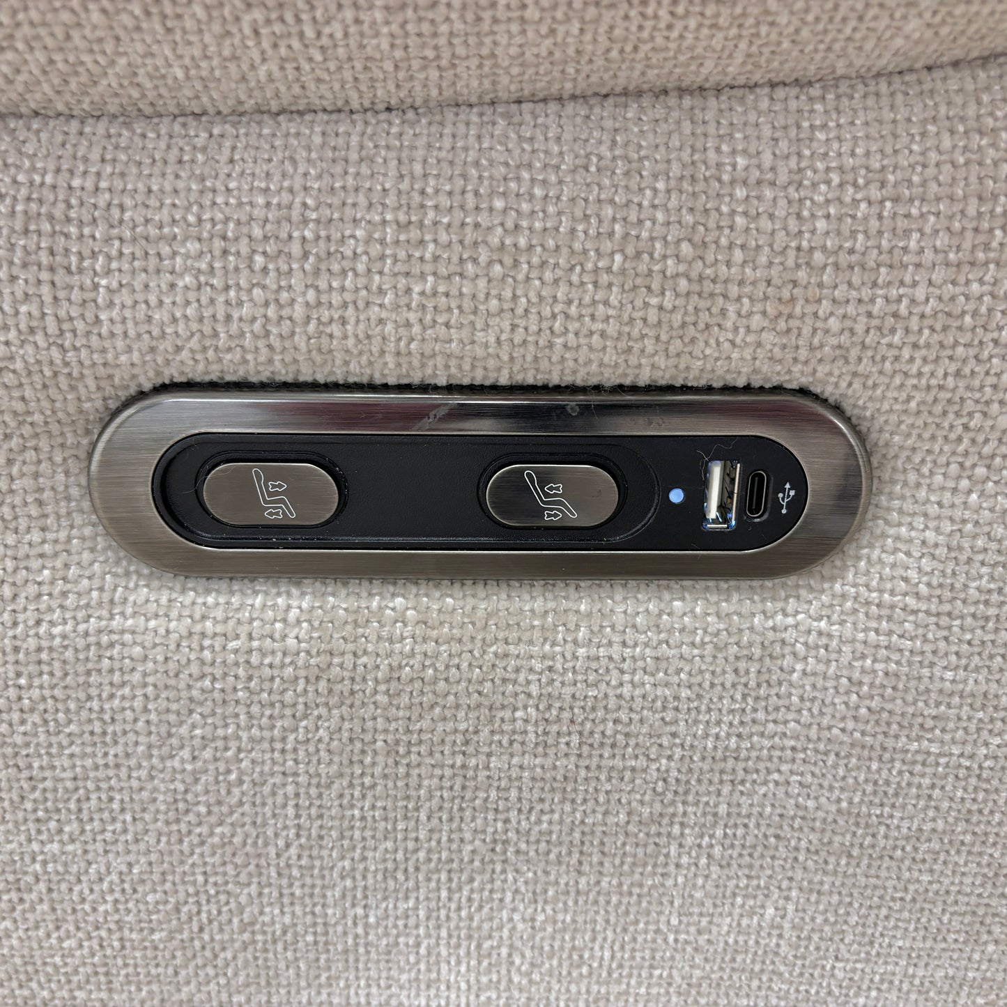 Close-up of the power control buttons located on the side of the 'Sloane' Recliner Chair.