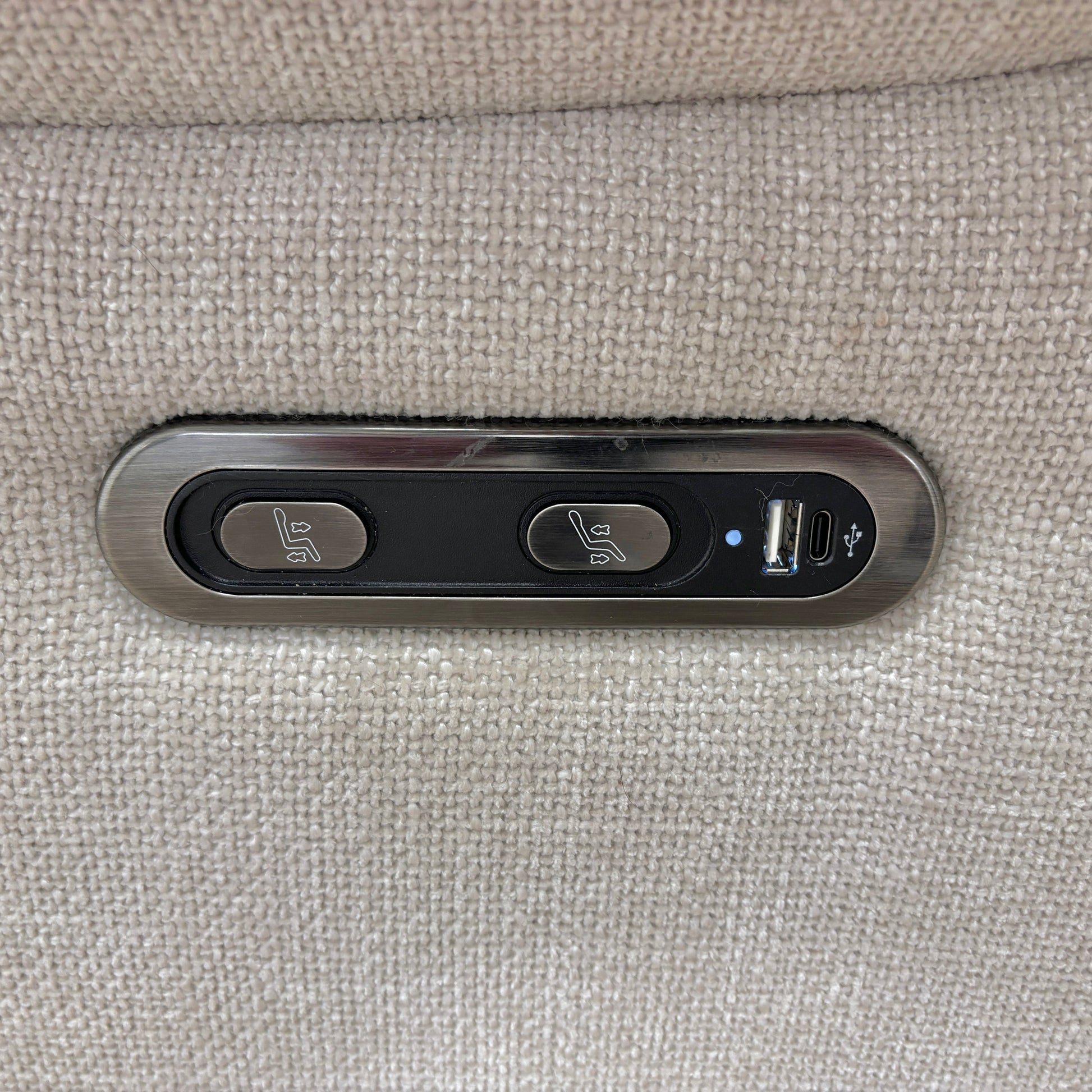 Close-up of the power control buttons located on the side of the 'Sloane' Recliner Chair.