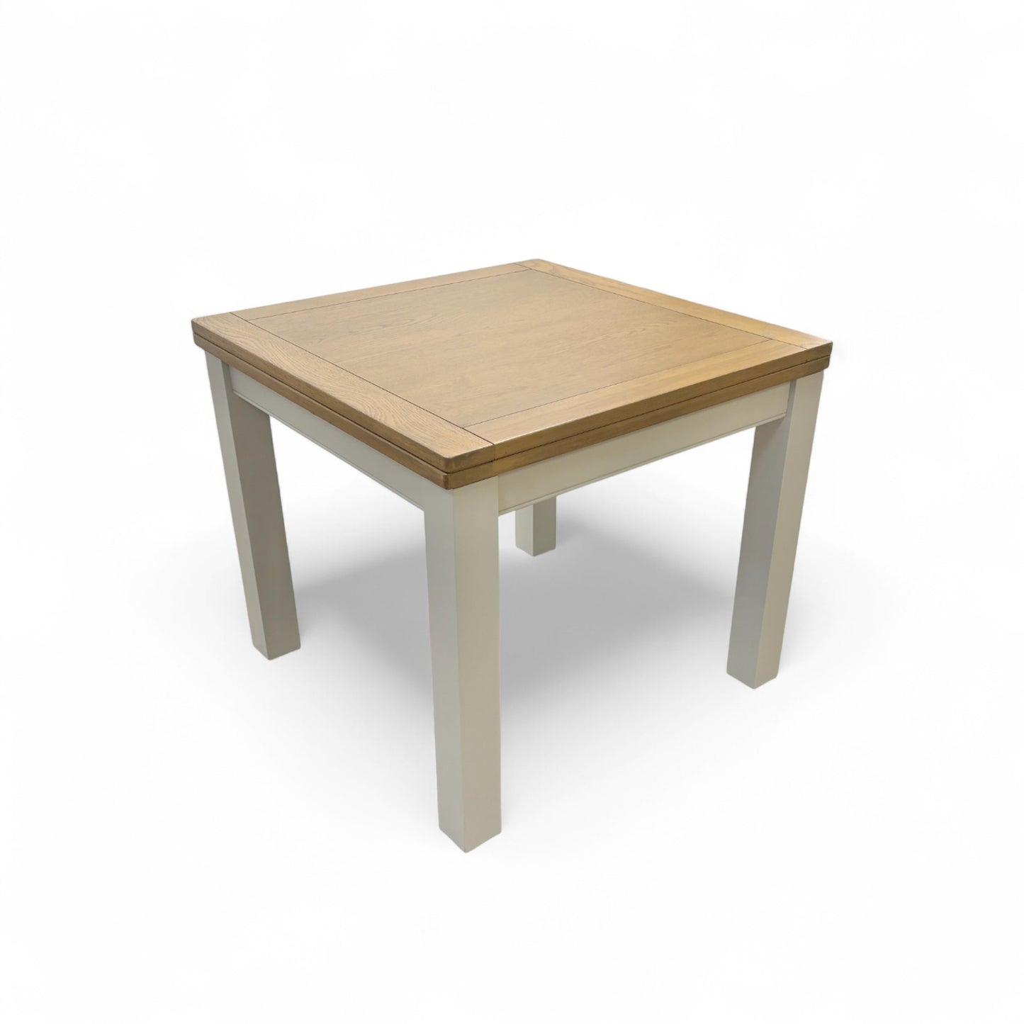 Angled view of the 'Hamilton' Solid American Oak Flip-Top Extending Dining Table, showing its full 180 cm length and chunky, modern country style.