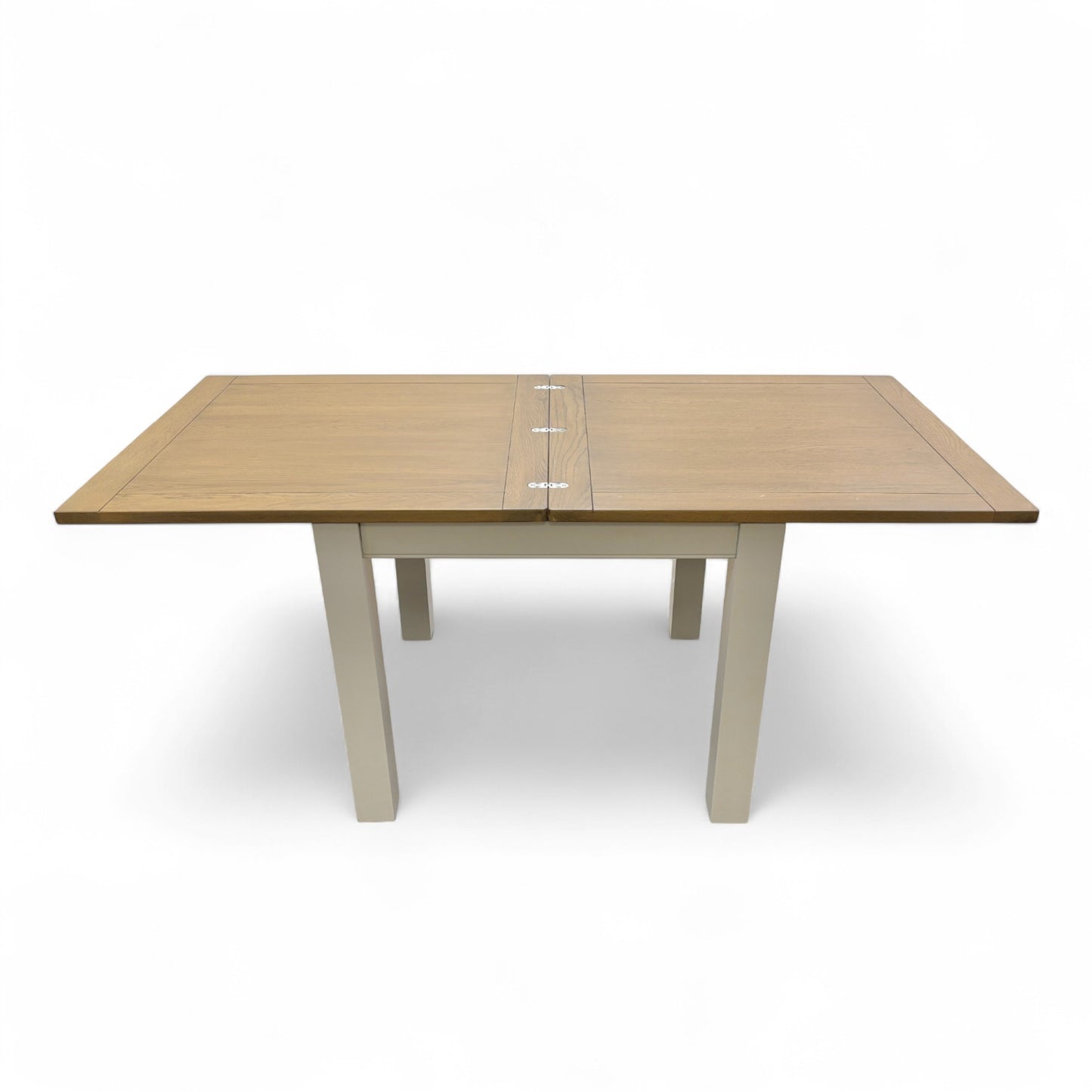 Image of the 'Hamilton' dining table during the process of converting from the closed square to the fully extended rectangular position.