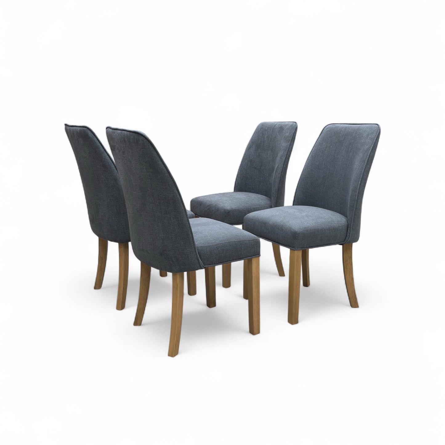 A single 'Hamilton' dining chair positioned at a dining table (or next to a table) to show scale and context.