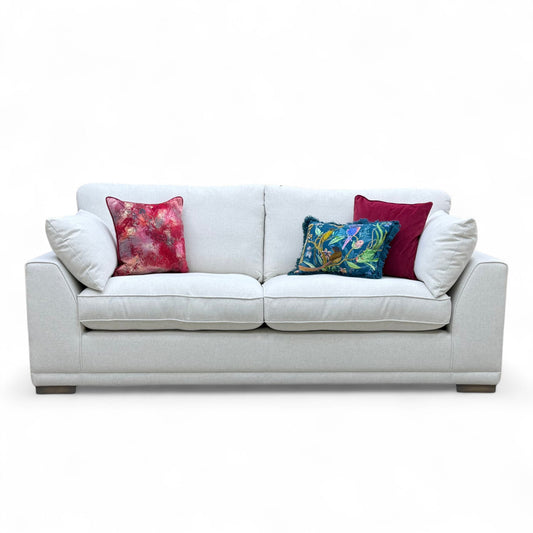 Three-quarter angle of the 'Dalton' Taupe Ashley Fabric Sofa, highlighting its generous size and relaxed modern style.