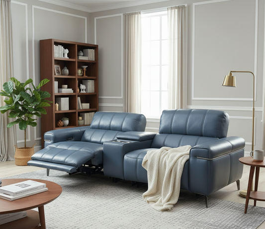 Modern living room with a blue sofa, bookshelf, and coffee table.
