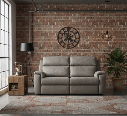 Gray sofa in a room with brick wall, clock, and plants