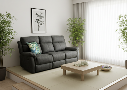 Modern living room with a gray sofa, wooden coffee table, and plants.