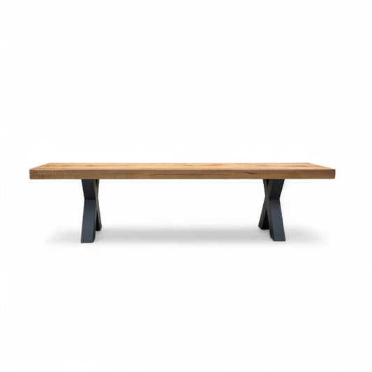 The Bodahl Njord Oak Dining Bench shown in a dining room setting, paired with a matching table and chairs to illustrate scale.