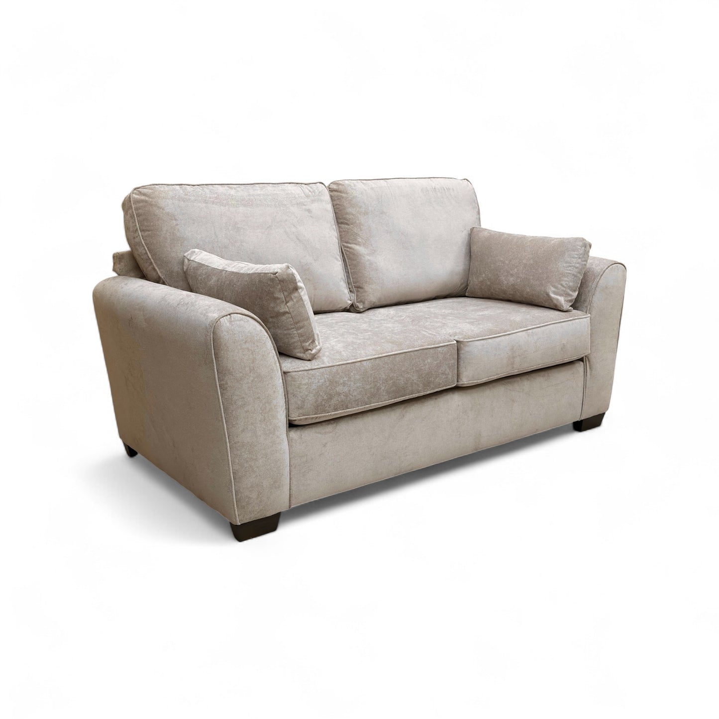 A tight shot focusing on the corner of the sofa, highlighting the sloped armrest and fabric texture.