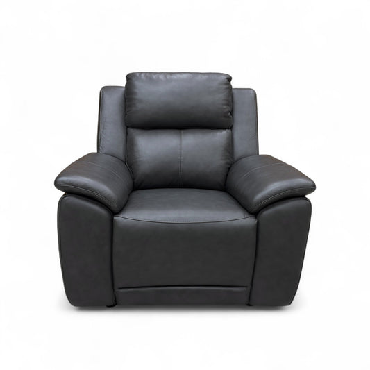 Full front view of the ‘Utah’ Leather Armchair in starry grey, showcasing its modern shape and padded armrests.