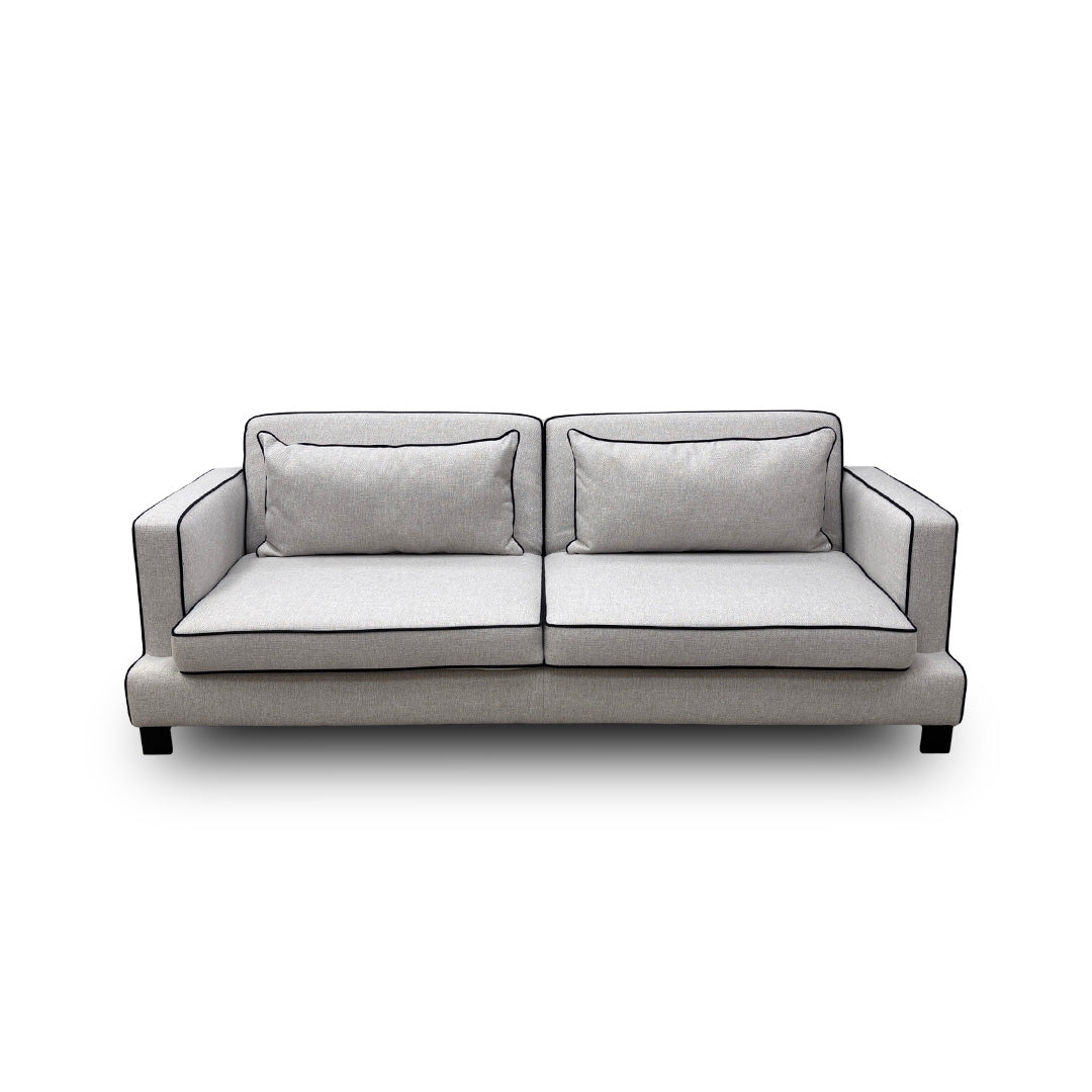 The 'Demure' 4 Seater Sofa Bed fully converted into its sleeping position, revealing the hidden mattress.